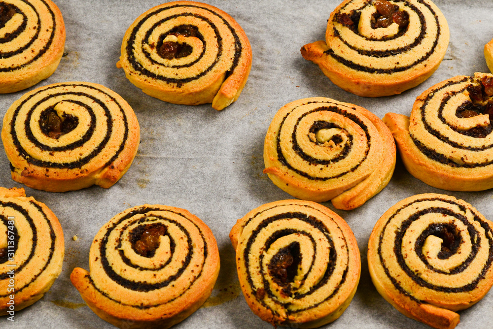 Fototapeta premium Baked cookies with raisins and poppy seeds on a trail.