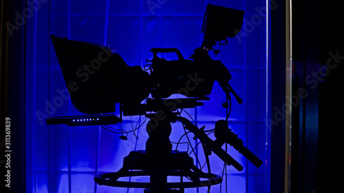 Принти на полотні professional studio camera in front of colorful backdrop, focus on camera