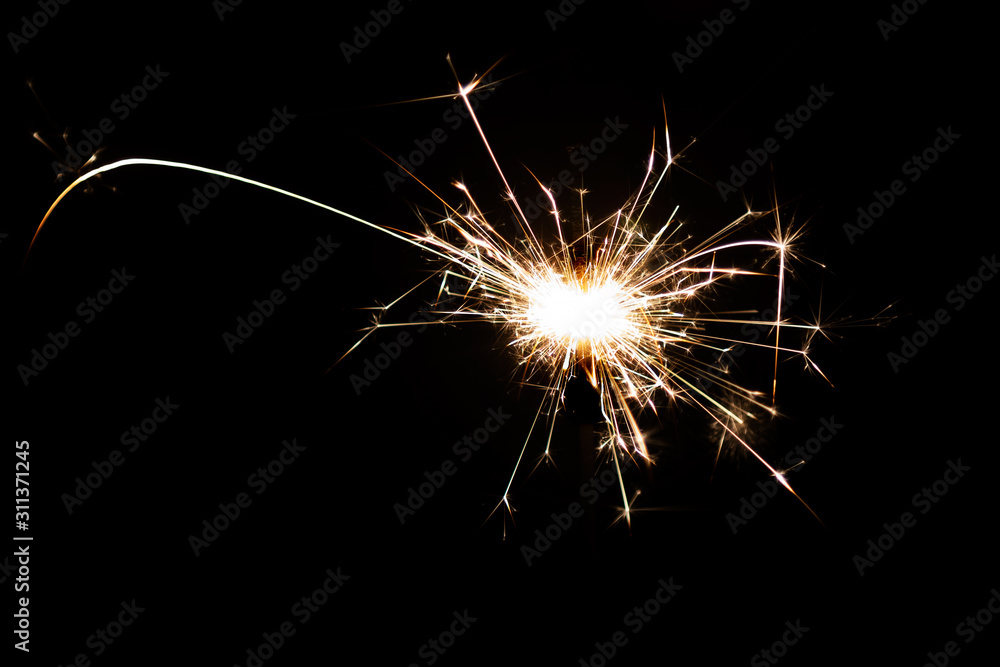 Burning sparkler, fireworks for holidays includes christmas, happy new year Burning sparkler, fireworks for holidays includes christmas, happy new year