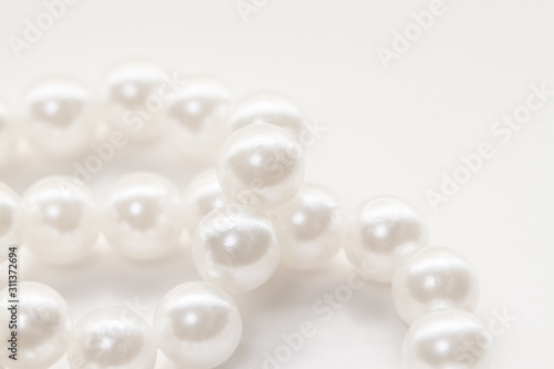 little pearl white beads string isolated background
