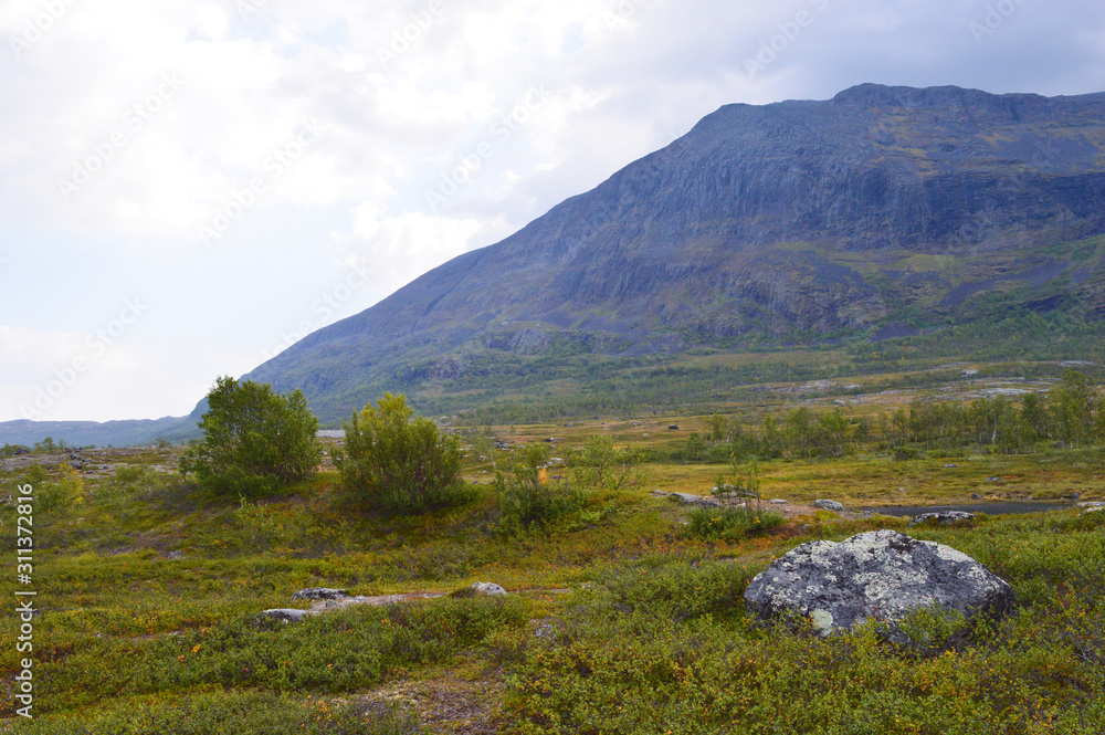 Beautiful nature and mountains during hike on kungsleden trail in national park Abisko, Sweden Beautiful nature and mountains during hike on kungsleden trail in national park Abisko, Sweden