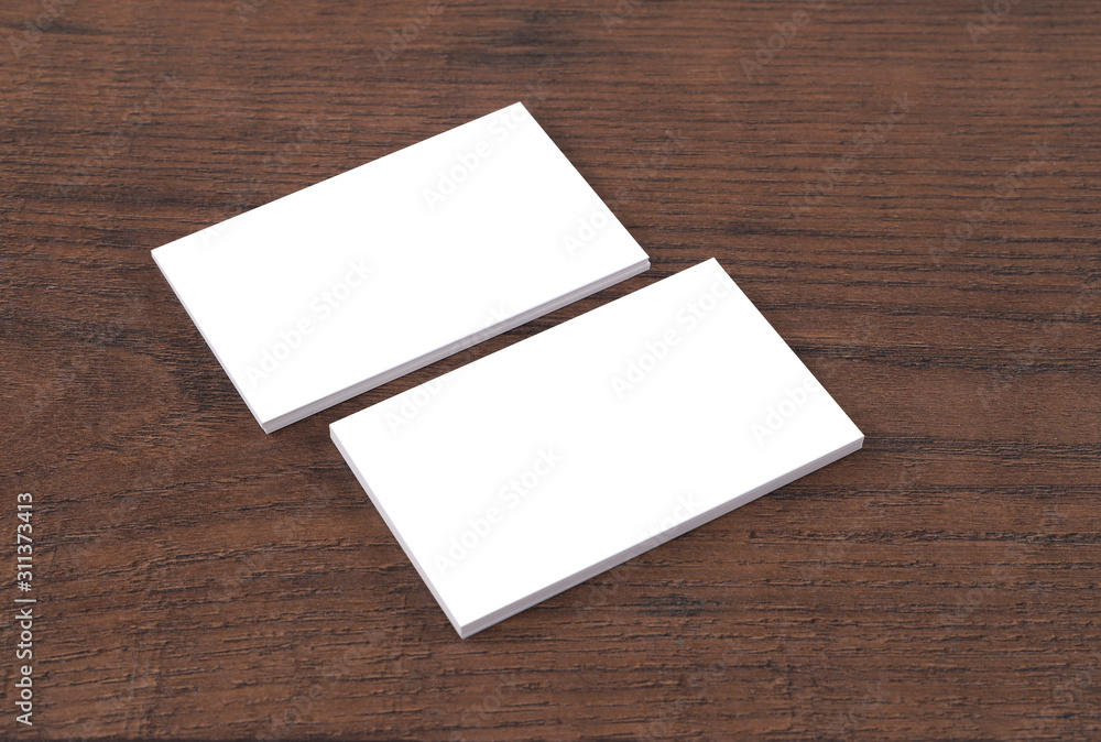 Mock up of business cards on wood background. Mock up of business cards on wood background.
