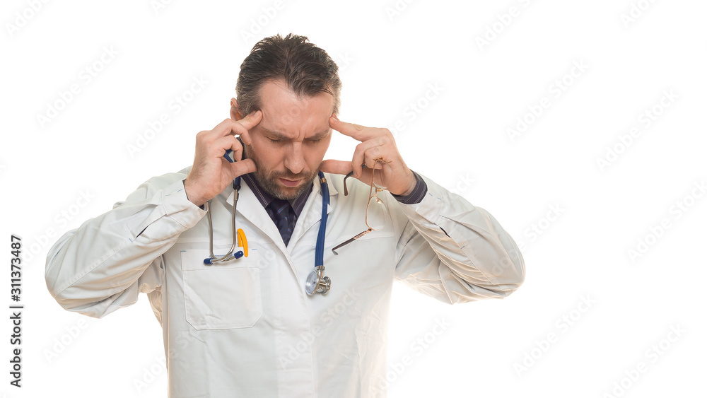 Tired male doctor with strong headache isolated on white. Tired male doctor with strong headache isolated on white.