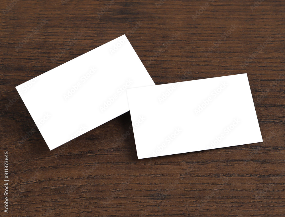 Mock up of business cards on wood background. Mock up of business cards on wood background.