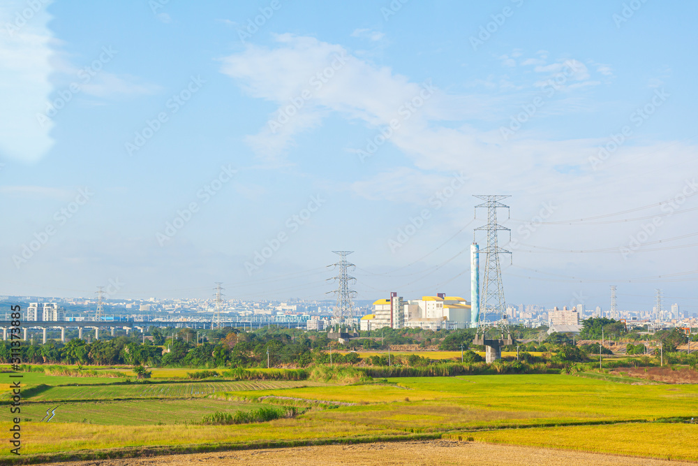 Landscape of green farm and river with high speed rail background at Taichung