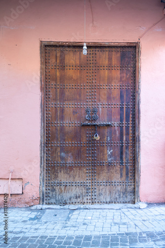 Brown wooden door in Marrakech © Jesus-Salas-Dual