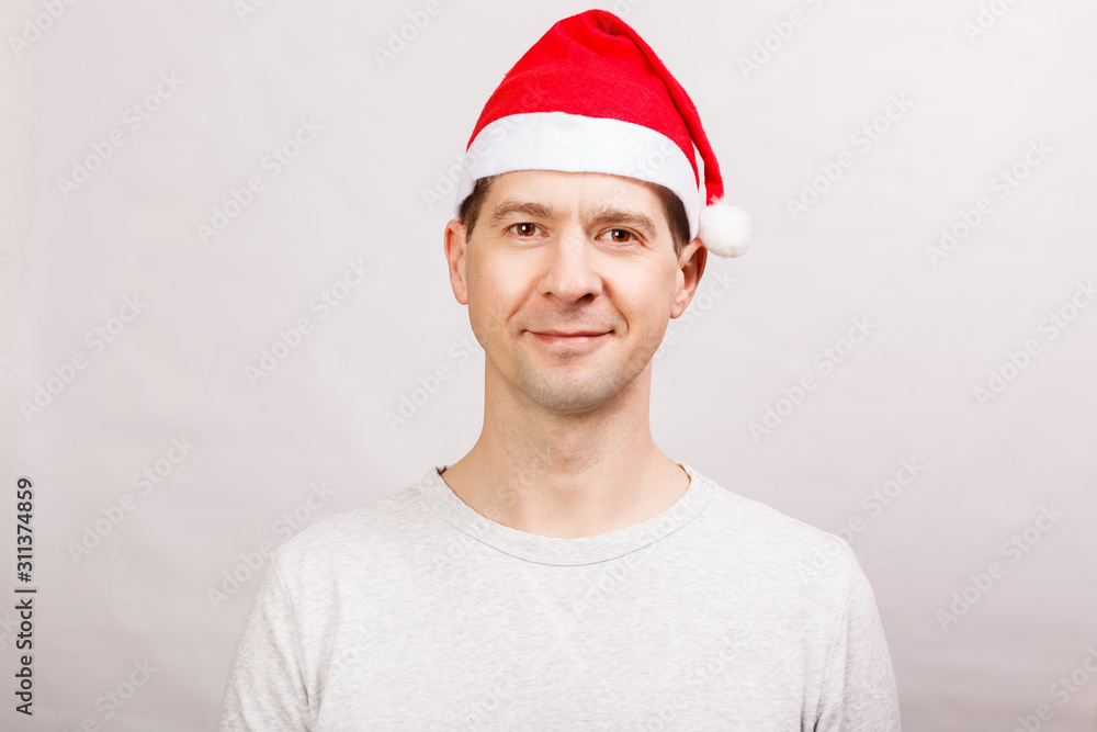Man in Santa Claus grandfather 's hat in T-shirt Man in Santa Claus grandfather 's hat in T-shirt