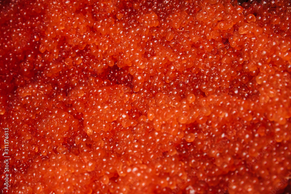 Red caviar. Abstract textured background for wallpaper.