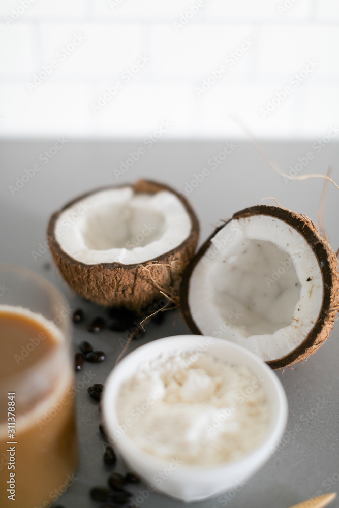 fresh cracked coconut on white marble background copy space fresh cracked coconut on white marble background copy space