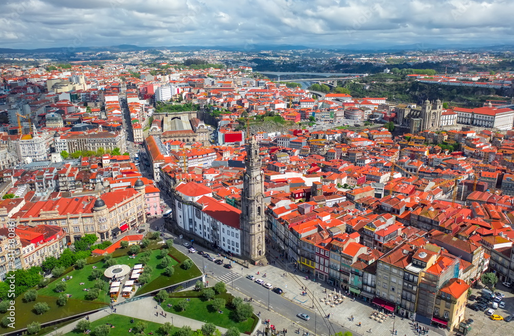 Porto Portugal aerial top view on catholic church or cathedral Torre dos Clerigos, central square cityscape, red roofs