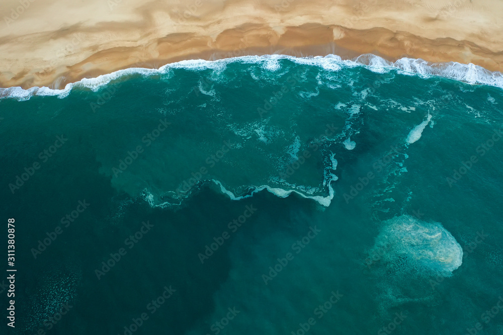ocean and beach aerial top view, foam wave pattern