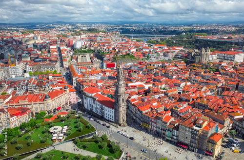 Porto Portugal aerial top view on catholic church or cathedral Torre dos Clerigos, central square cityscape, red roofs