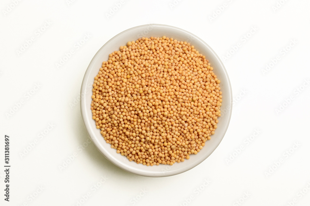 top view of mustard seeds in white bowl top view of mustard seeds in white bowl