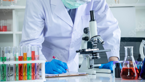 The concept of medical, chemicals or scientific laboratory research and Innovation in the laboratory. experienced man scientist is performing work in the laboratory.