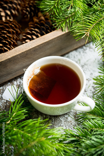 Cup of tea with forest decorations. Selective focus. Shallow depth of field.