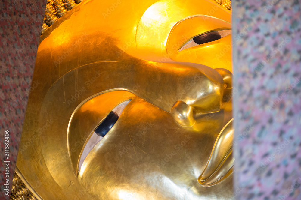 Reclining Buddha gold statue in Wat  Phra Chettuphon Wimon Mangkhalaram (Wat pho), Bangkok, Thailand
