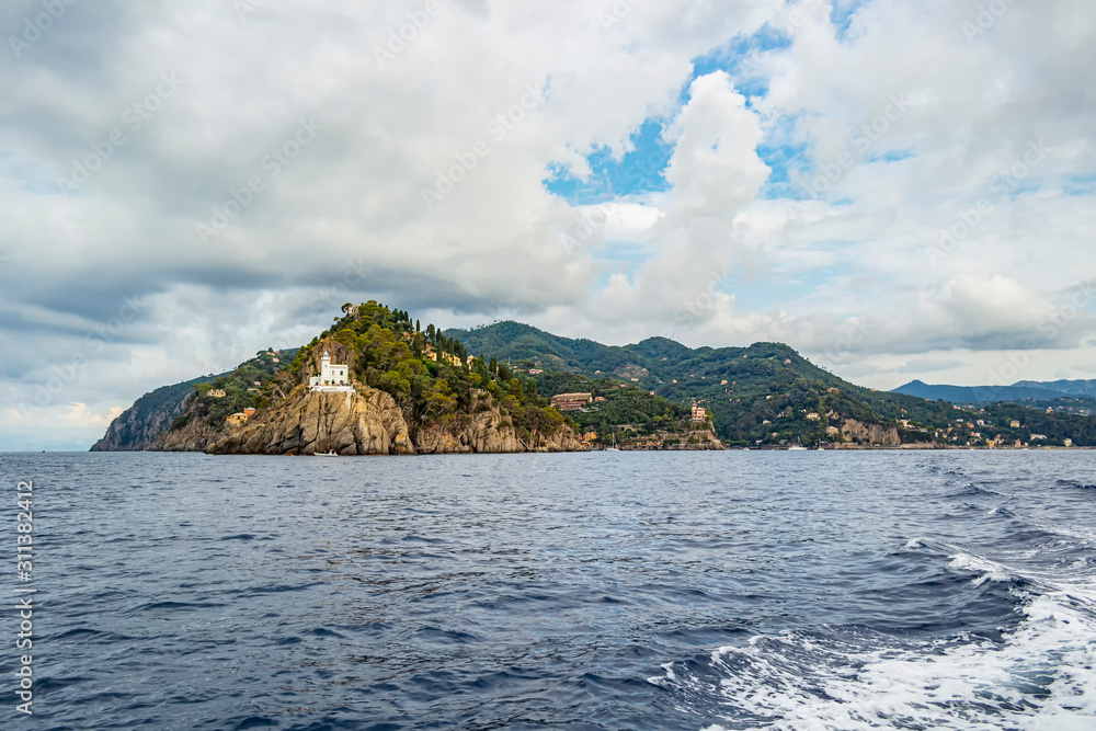 View on Portofino lighthouse from the sea, Liguria - Italy View on Portofino lighthouse from the sea, Liguria - Italy