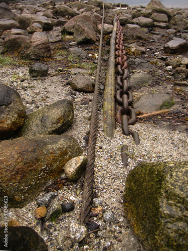Chain on stone beach