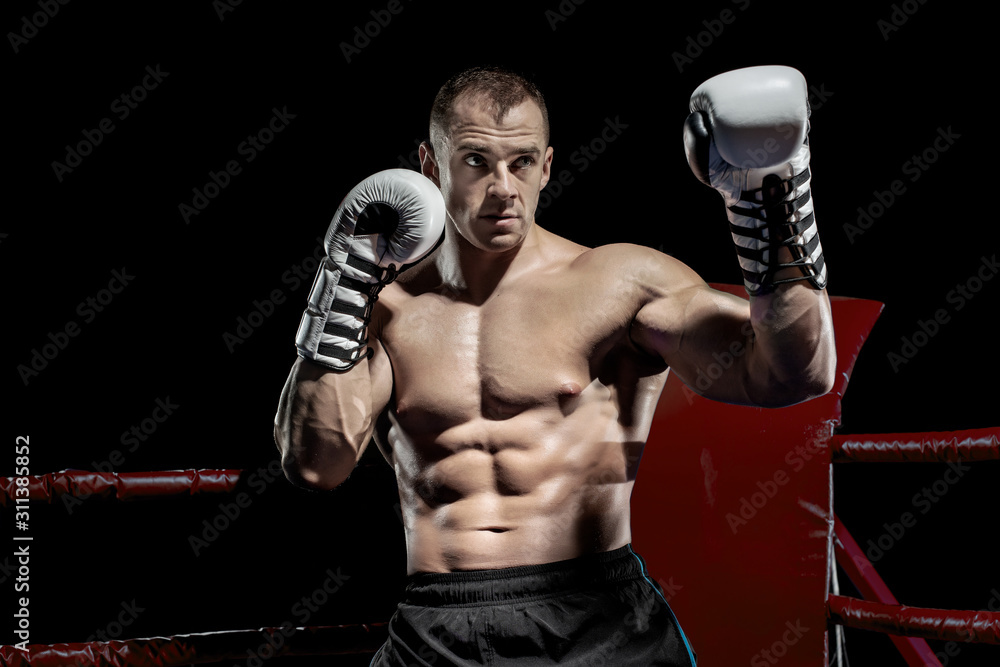 punching boxer on boxing ring