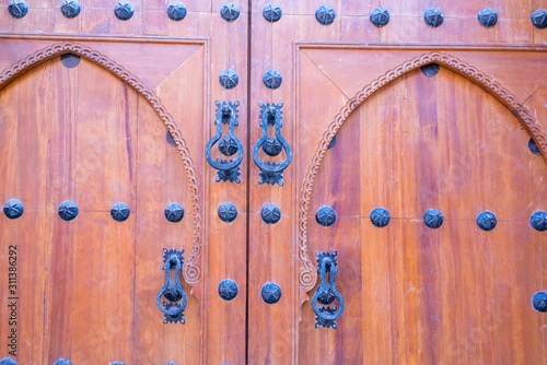brown arabic style wooden door in marrakech