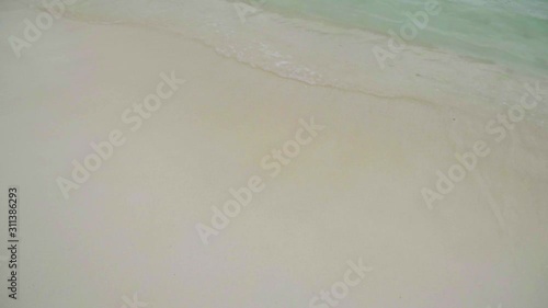 Sea waves on the beach background.