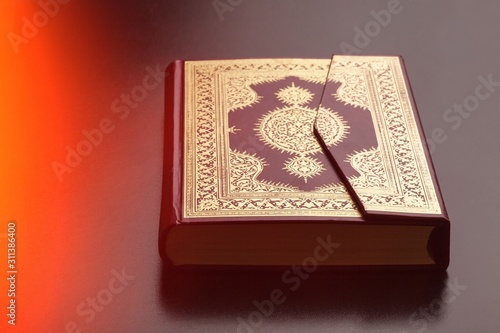 Islamic Book Koran with rosary on background