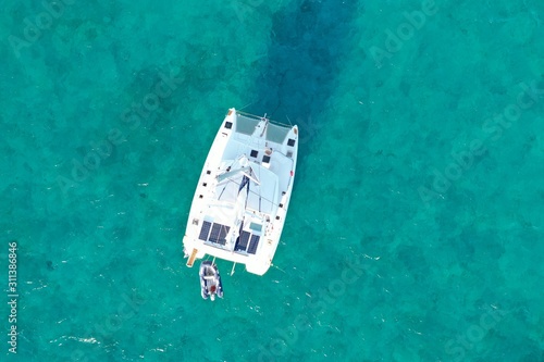 Catamaran on turquoise blue Caribbean Ocean 