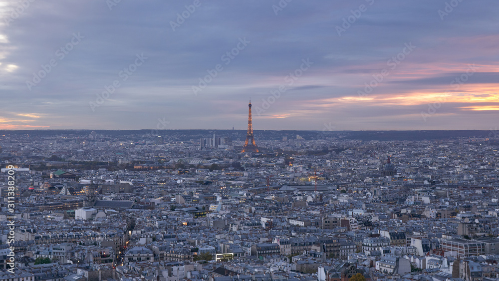 Eiffel Tower in in Paris, aerial panoramic view from the top of Montmartre at sunset, France.