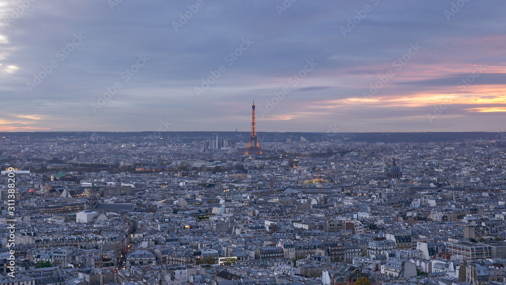 Eiffel Tower in in Paris, aerial panoramic view from the top of Montmartre at sunset, France. Eiffel Tower in in Paris, aerial panoramic view from the top of Montmartre at sunset, France.