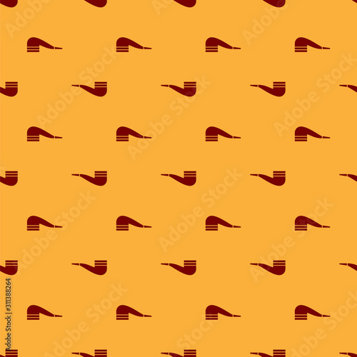 Red Smoking pipe with smoke icon isolated seamless pattern on brown background. Tobacco pipe.  Vector Illustration