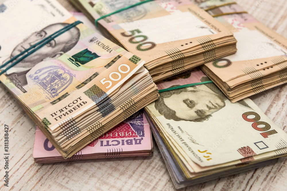 bundle of Hryvnia uah - 100 200 500 on desk