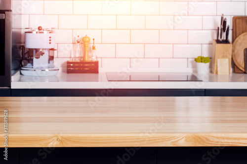 Close up shot of counter top or wooden table on the modern kitchen