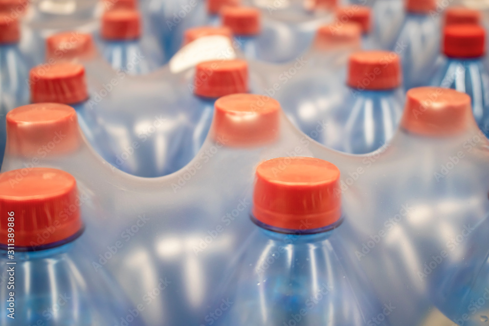 Water in plastic bottles.