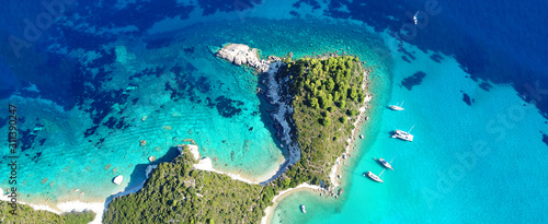 Aerial drone ultra wide panoramic photo of tropical exotic seascape in Mediterranean Greek Ionian island of Paxos with turquoise sea