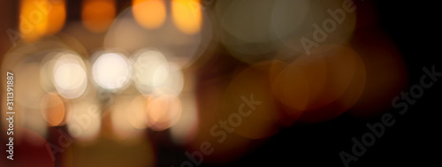 Abstract city lights blur blinking background. Soft focus. Horizontal long banner. photo