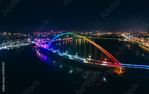 Crescent Bridge - landmark of New Taipei, Taiwan with beautiful illumination at night, photography in New Taipei, Taiwan. © yaophotograph