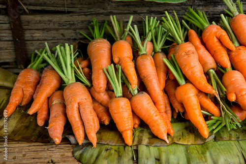 fresh carrots bunch in vegetable market.