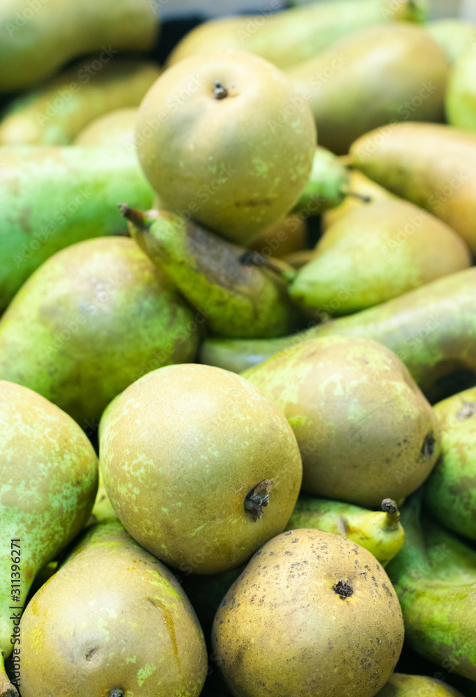 Green pears background on the market