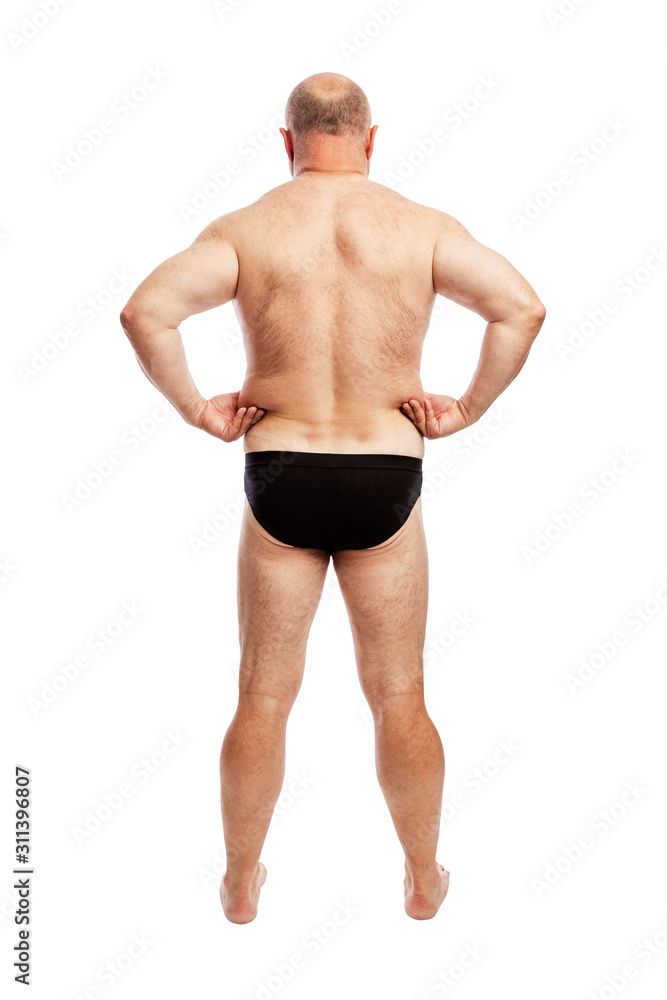 Fat man in shorts. Back view. Full height. Isolated over white background. Vertical. Stock Photo Adobe Stock