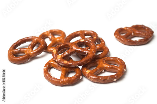 Closeup of salted pretzels on white background