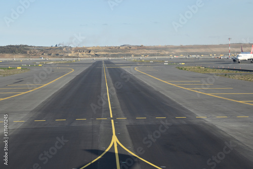 Marking for ground transportation on the airport apron among taxiways photo