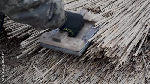 Reed roof. The master makes reed roof.