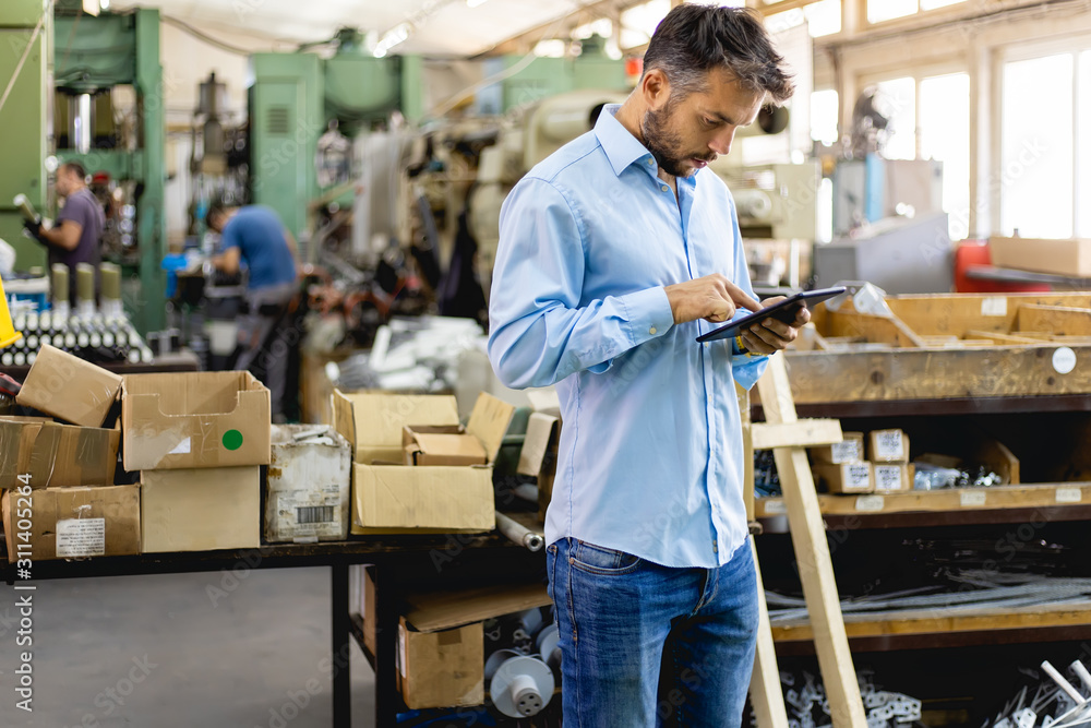 Businessman in factory. Engineer in production Businessman in factory. Engineer in production