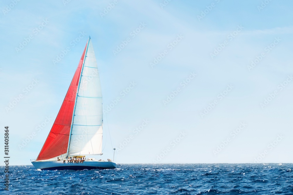 Sailboat In The Peaceful Blue Ocean