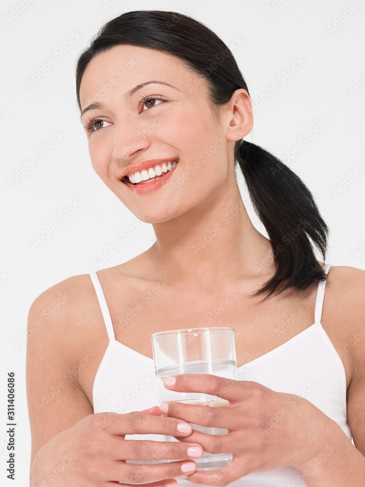 Young Woman Holding Glass Of Water Young Woman Holding Glass Of Water