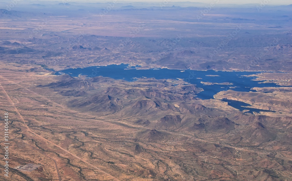 Arizona Rocky Mountains Aerial view from airplane of abstract Landscapes, peaks, canyons and rural cities flying in to Phoenix, AZ. United States of America. USA.