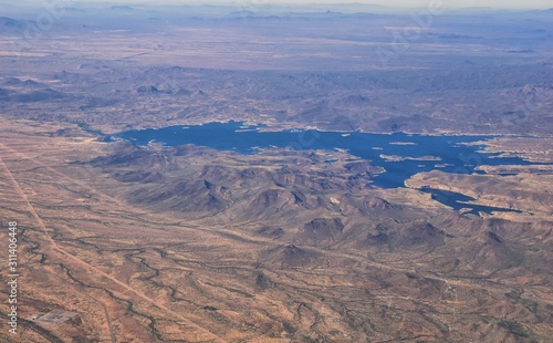 Arizona Rocky Mountains Aerial view from airplane of abstract Landscapes, peaks, canyons and rural cities flying in to Phoenix, AZ. United States of America. USA.