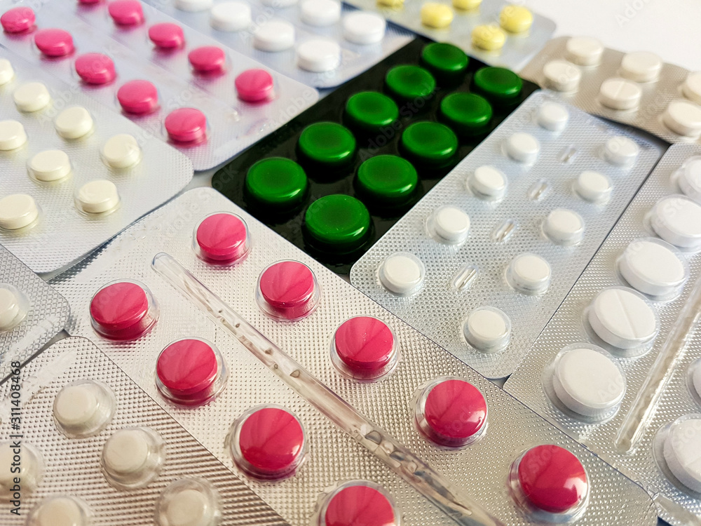 Pharmaceuticals. Antibiotics, various pills on a white background. Pharmaceuticals. Antibiotics, various pills on a white background.