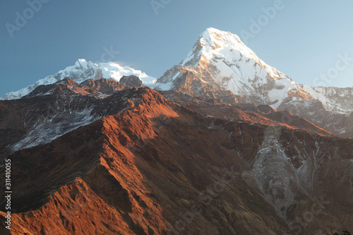 Machapuchare mountain in big white clouds. Nepal. Himalaya