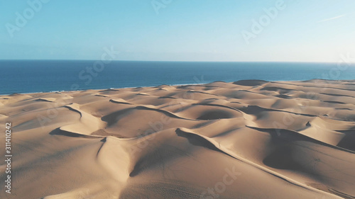 Bird s-eye view of the Dunes Maspalomas  Gran Canaria  at sunset or sunrise. Aerial